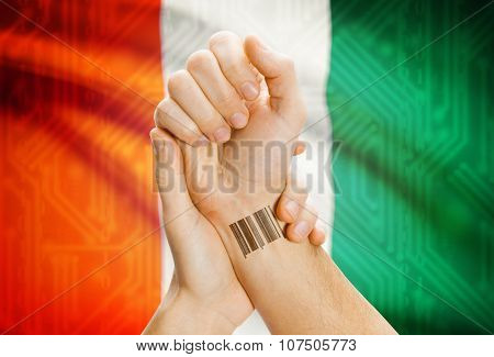 Barcode Id Number On Wrist And National Flag On Background - Ivory Coast