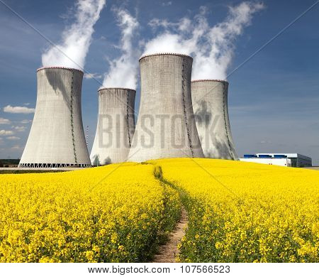 Nuclear Power Plant Dukovany With Golden Flowering Field