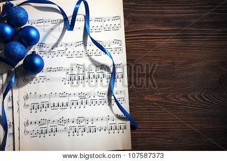 Music and Christmas decor on wooden table