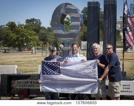 WASHINGTON DC - SEPT 11, 2015: U.S. Congressman Dave Brat (R-Va.) by the 911 Standing Tall Memorial sculpture by SteelCrazy IronArt in front of the U.S. Capitol at 2 Million Bikers to DC honor ride.