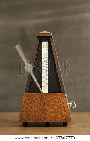 Classic metronome isolated on white background