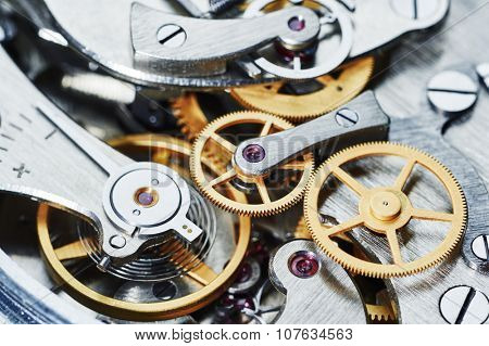 Time concept. clock mechanism close-up view. Shallow DOF.