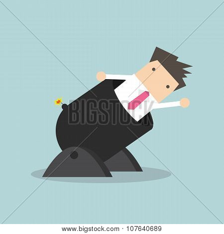 Businessman in a big cannon is ready to go