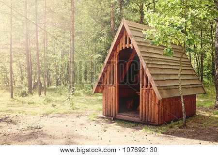 A Wooden Arbor In Forest