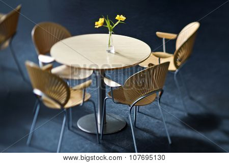 Table and chairs shot with a tilt and shift lense
