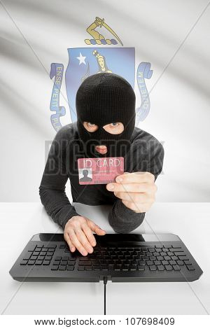 Hacker With Usa States Flag On Background And Id Card In Hand - Massachusetts