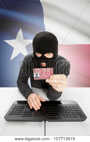 Hacker With Usa States Flag On Background And Id Card In Hand - Texas