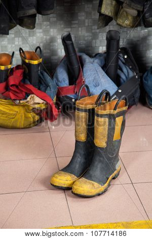Firefighter's shoes on tiled floor at fire station