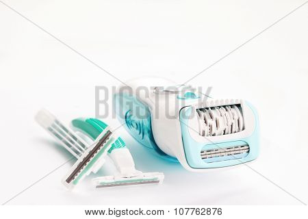depilator and razor on white - beauty treatment