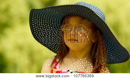 Cute Little Girl In Big Hat Pretending To Be Lady
