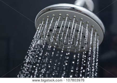 Shower Head In Bathroom With Water Drops Flowing
