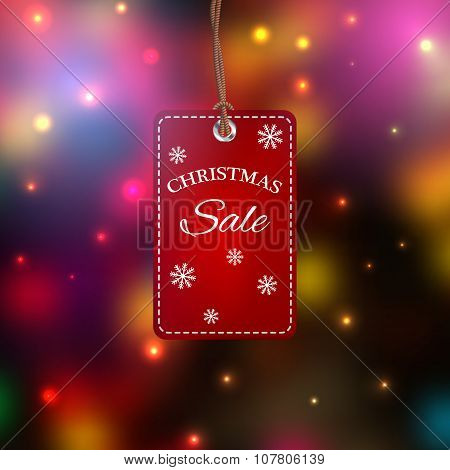 Christmas Sales Tag. Label  On A Colorful Blurred Background