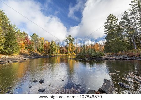 River Flowing Through A Forest In Autumn - Ontario, Canada