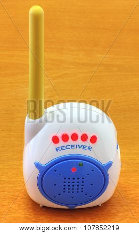 Babyphone on wooden background closeup