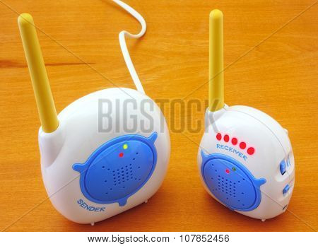 Babyphone on wooden background closeup