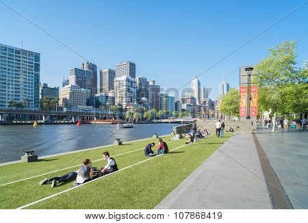 Southbank Promenade With People And Melbourne Skyline