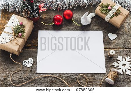 Cute vintage christmas new year gifts mock up on wooden background.