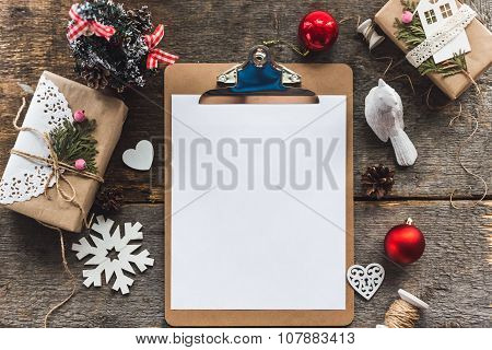Cute vintage christmas new year gifts mock up on wooden background.