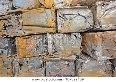 Compressed packages blocks scrap of metal
