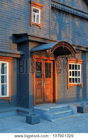 Blue Grey Wooden House Facade In Sunset