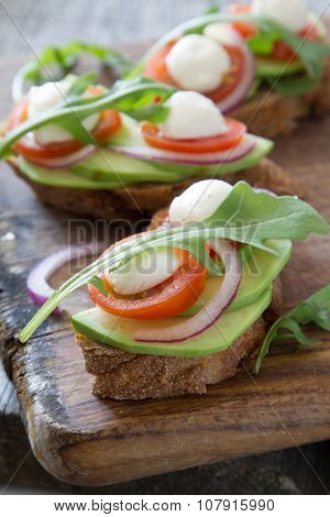 Avocado mozzarella and tomato bruscetta