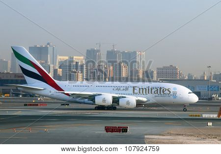 DUBAI, UAE - NOVEMBER 10, 2015: The Airbus A380 Emirates take off on Dubai International Airport. Plane for 615 passengers is biggest airliner on the world.