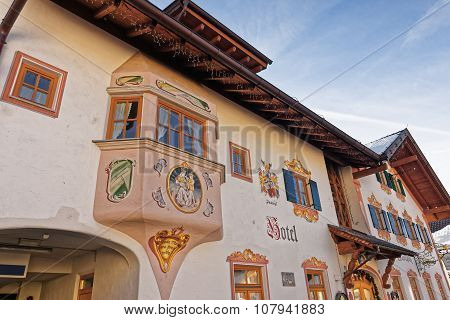 GARMISCH-PARTENKIRCHEN GERMANY - JANUARY 06 2015: Closeup view of the facade of a hotel in Garmisch-Partenkirchen beautifully adorned with religious and historic painted scenes