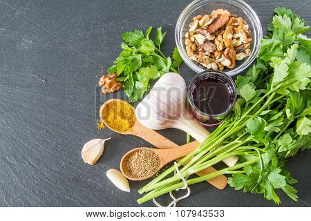 Georgian sauce ingredients on dark stone background