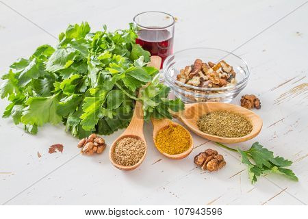 Georgian sauce ingredients on white wood background