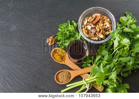 Georgian sauce ingredients on dark stone background