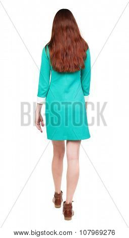 back view of walking  woman. beautiful girl in motion.  backside view of person.  Rear view people collection. Isolated over white background. girl in a stylish vintage dress from us is