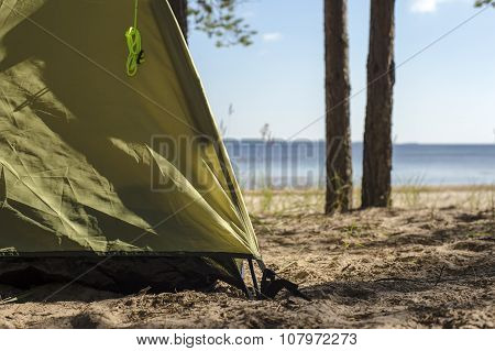 Edge Of Tourist Tents, Which Stands On A Sandy Beach Near The Water