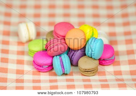 Colorful Macaroons On Checkered Tablecloth