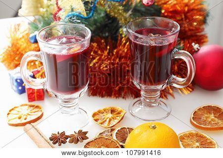 mulled wine with decorated christmas tree