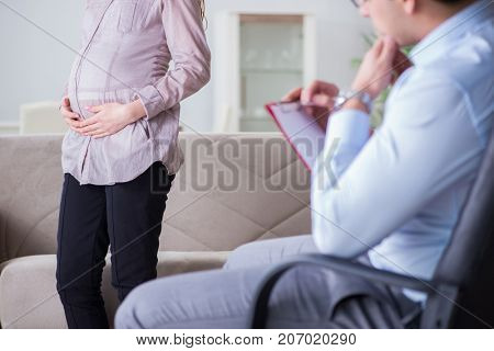 Pregnant woman visiting psychologist doctor