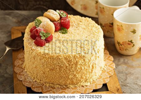 Napoleon layered cake with raspberry and macaron almond cookies