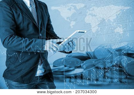 Businessman In A Suit Holding A Tablet Chek Stock,trading On Stock Market Concept
