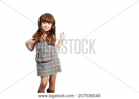 Music passion lifestyle concept : Happy little cute girl in headphones listening to music and dancing isolated on white background with clipping path. Cute mixed race Asia Europe girl 5 years old