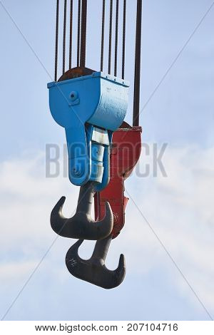 Heavy old steel hooks in a porr