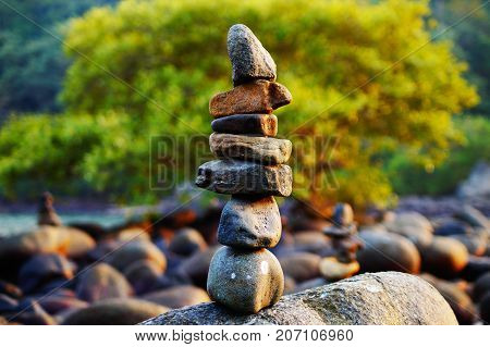 Japanese rock garden on Palolem beach in Goa, India. Zen (dzen) stones. Indian nature. Meditation and relax place on the beach.