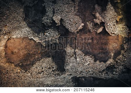 Black wall background. Grunge texture with stone and old iron parts