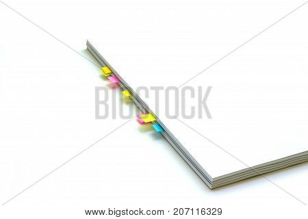 white book with color bookmarks with isolated white background