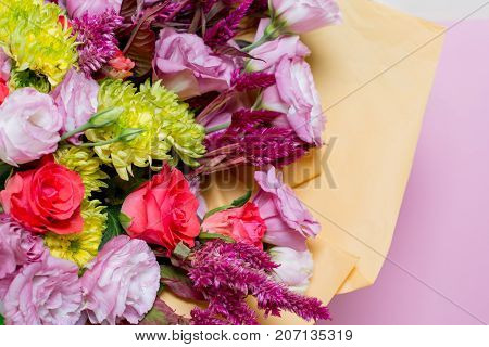 A Beautiful Bouquet Of Pink Eustoms, A Yellow Chrysanthemum, A Red And Pink Rose, On A Pink Backgrou