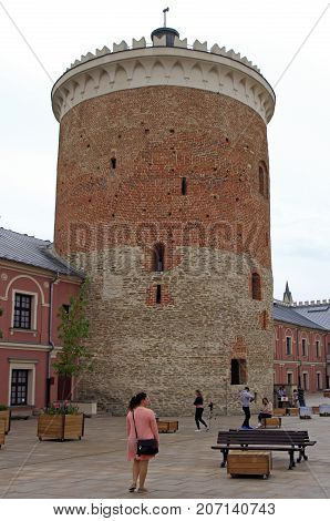 Lublin Poland - June 25 2017: people are walking at the keep tower in Lublin castle, Poland