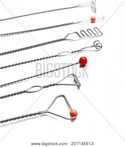 Set of instruments for speech therapist on white background