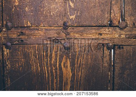 Old wood texture and background. Old wooden door background. Close up view of rough wood texture and background. Abstract texture and background for designers. Vintage wood table.