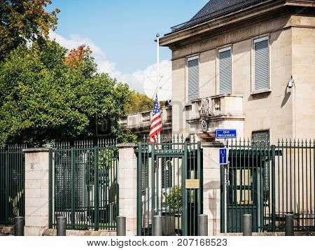 PARIS FRANCE - OCT 3 2017: US United States American Flag flying half-mast in court of the US Embassy after the 2017 Las Vegas Strip shooting in United States with about 60 fatalities and 527 injuries