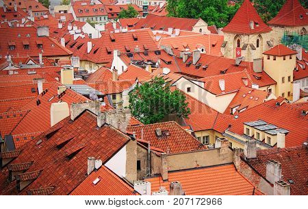 Top view to red tile roofs of Prague city Czech republic. Typical Prague houses.