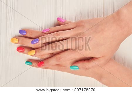 Female hands with bright summer manicure. Woman hands with pastel polish on nails. female hands with summer colorful manicure.