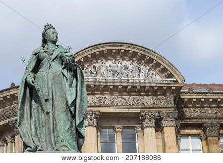 Birmingham, UK, October 3rd, 2017 : Statue of Queen Victoria in Birmingham, UK, Birmingham city council in the background.
